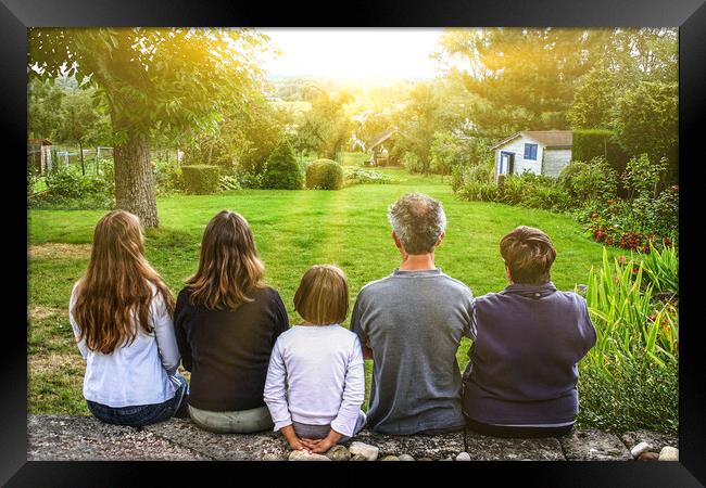 A group of people sitting at a park Framed Print by Ankor Light