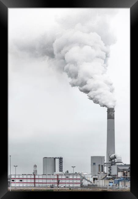 A factory with smoke coming out of it Framed Print by Ankor Light