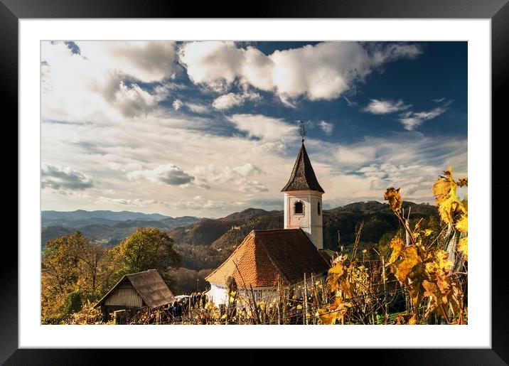 A church with a mountain in the background Framed Mounted Print by BRANKO BALAŠKO