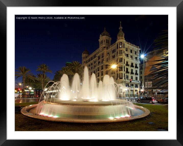 A fountain lit up at night, Alicante, Spain Framed Mounted Print by Navin Mistry