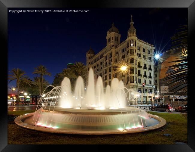 A fountain lit up at night, Alicante, Spain Framed Print by Navin Mistry