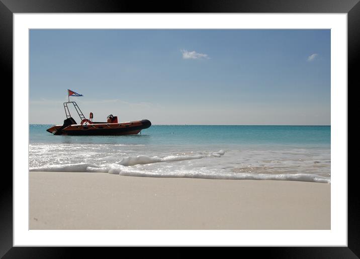 A boat on a beach near a calm water of ocean Framed Mounted Print by Alessandro Della Torre