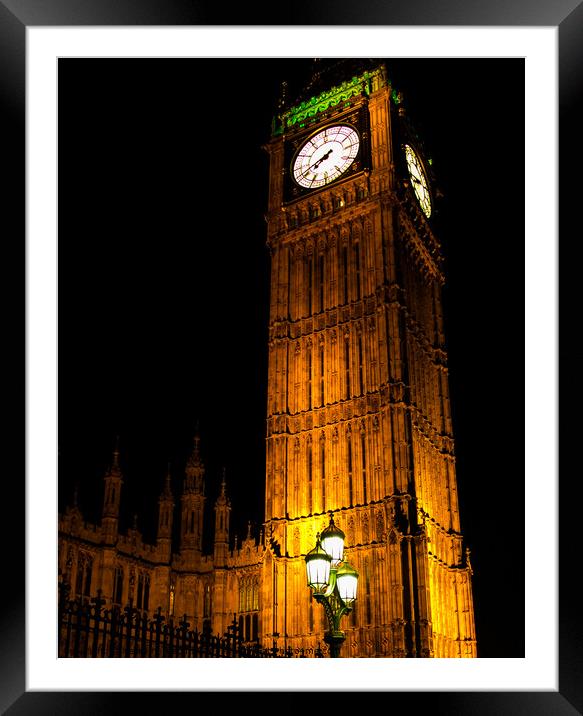 A clock tower lit up at night Framed Mounted Print by henry harrison