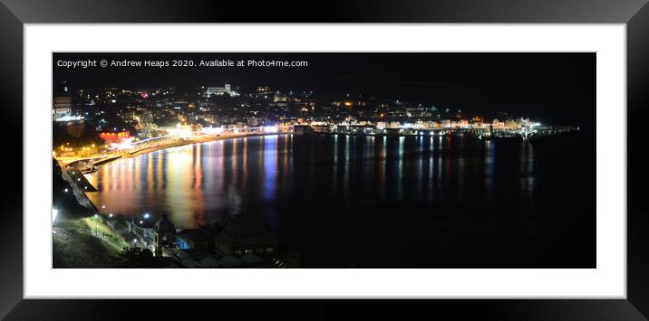 A large body of water with a city in the backgroun Framed Mounted Print by Andrew Heaps