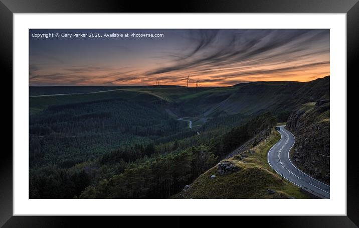 Sunset over a winding, mountain road	 Framed Mounted Print by Gary Parker