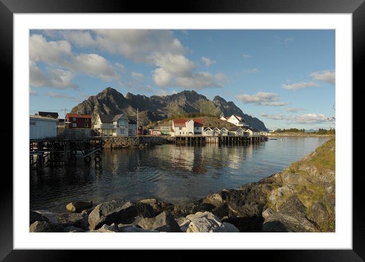 Lofoten island in front of water with a mountain in the background Framed Mounted Print by Alessandro Della Torre