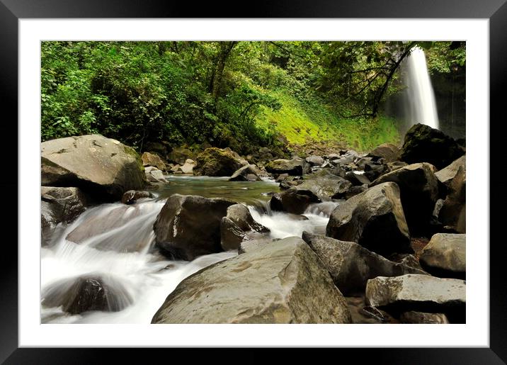 A large waterfall over a rocky cliff on rainforest jungle Framed Mounted Print by Alessandro Della Torre