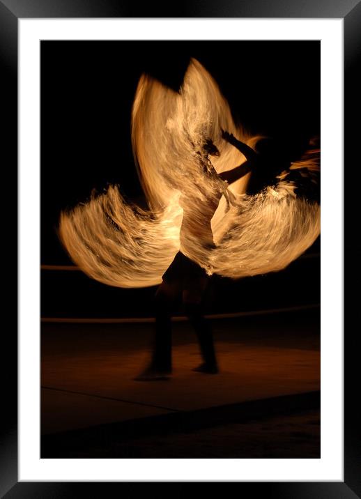 Fire dancer making night show with flames rotaint torch Framed Mounted Print by Alessandro Della Torre