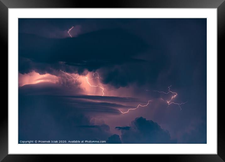 Lightning strike on the dark cloudy sky Framed Mounted Print by Przemek Iciak
