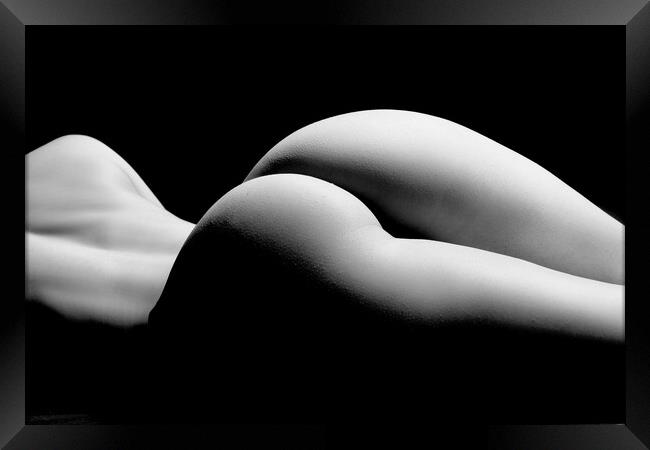 ass of a woman naked and nude fine art photography bodyscape laying on black studio background Framed Print by Alessandro Della Torre
