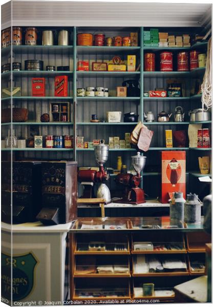 Shelves with products in old store Canvas Print by Joaquin Corbalan