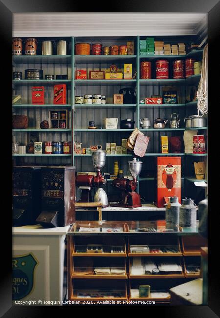 Shelves with products in old store Framed Print by Joaquin Corbalan