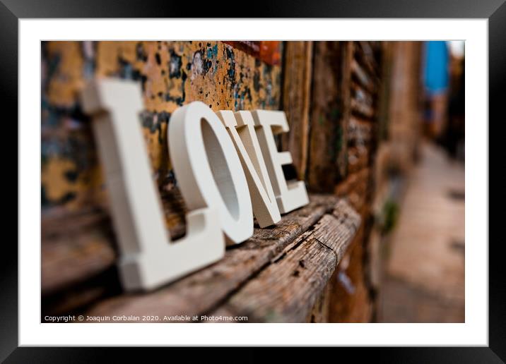 Wooden letters forming the word love Framed Mounted Print by Joaquin Corbalan