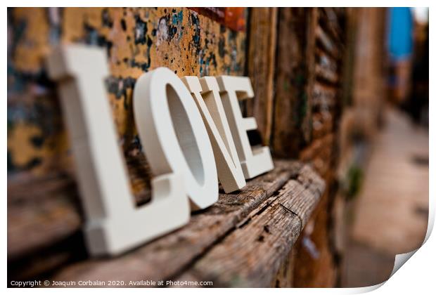 Wooden letters forming the word love Print by Joaquin Corbalan