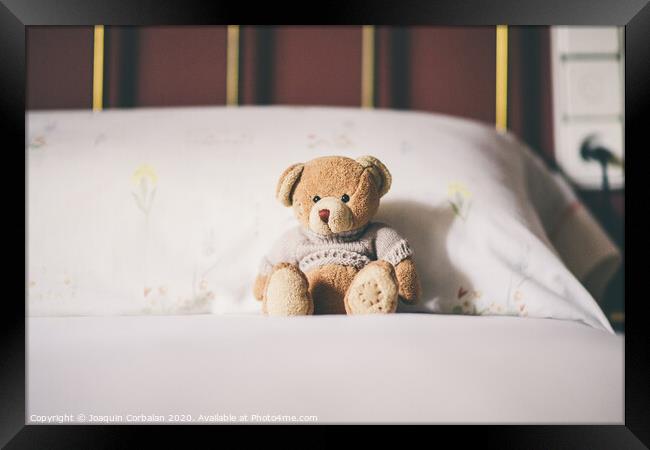Teddy bear on the bed, space for text. Framed Print by Joaquin Corbalan