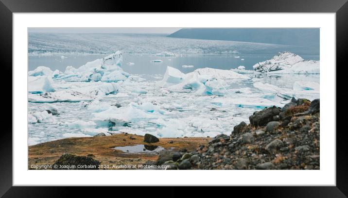 Huge blocks of ice on Glacial river and blue icebergs on Jokulsarlon glacier lake. Vatnajokull National Park, Iceland. Framed Mounted Print by Joaquin Corbalan