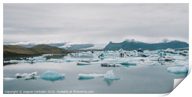 Huge blocks of ice on Glacial river and blue icebergs on Jokulsarlon glacier lake. Vatnajokull National Park, Iceland. Print by Joaquin Corbalan