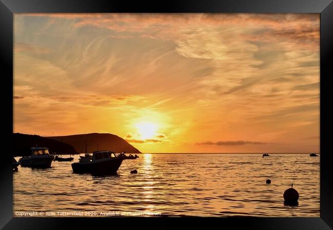A sunset behind a boat on the sea Pembrokeshire Framed Print by Julie Tattersfield