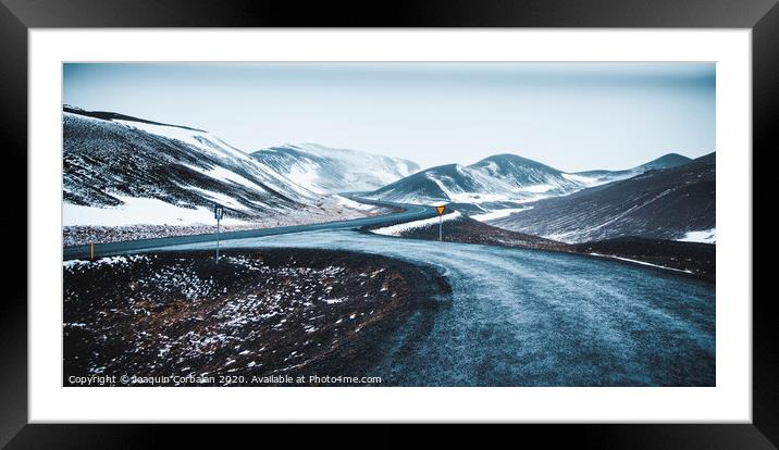 Asphalt mountain roads crossing dangerous Icelandic passes during a trip. Framed Mounted Print by Joaquin Corbalan