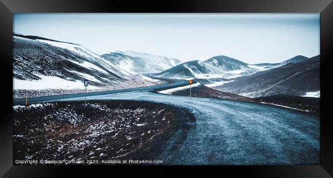 Asphalt mountain roads crossing dangerous Icelandic passes during a trip. Framed Print by Joaquin Corbalan