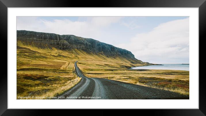 Asphalt mountain roads crossing dangerous Icelandic passes during a trip. Framed Mounted Print by Joaquin Corbalan