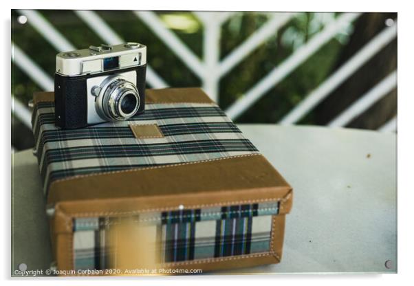 Old analog photo camera on a vintage travel suitcase. Acrylic by Joaquin Corbalan