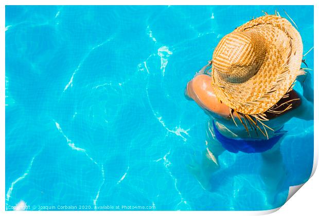Woman in a pool with hat relaxed and rested. Print by Joaquin Corbalan