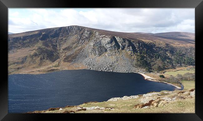 Guiness Lake in County Wicklow. Ireland Framed Print by John Biggadike