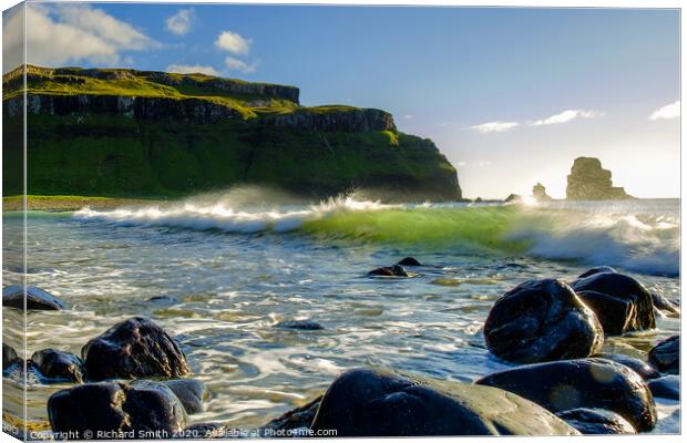 A comber breaks as it approaches Talisker beach. Canvas Print by Richard Smith