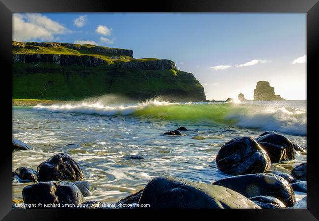 A comber breaks as it approaches Talisker beach. Framed Print by Richard Smith