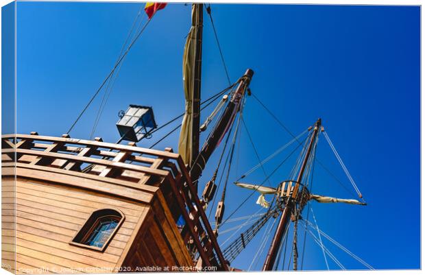 Stern of old galley docked in port to navigate the ocean in the discovery of America. Canvas Print by Joaquin Corbalan