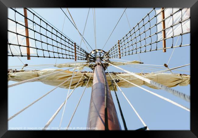 Mainmast and rope ladders to hold the sails of a sailboat. Framed Print by Joaquin Corbalan