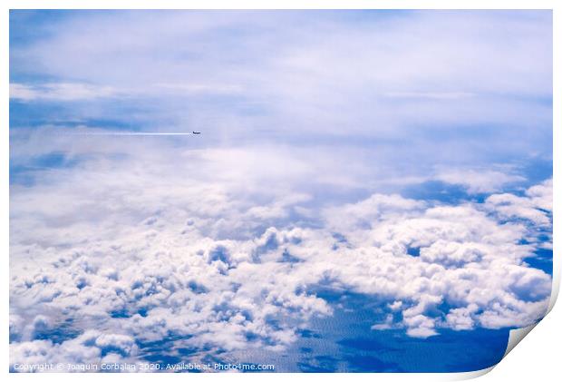 Plane of commercial flights crossing a sky of blue and white clouds seen from above, on the Mediterranean. Print by Joaquin Corbalan