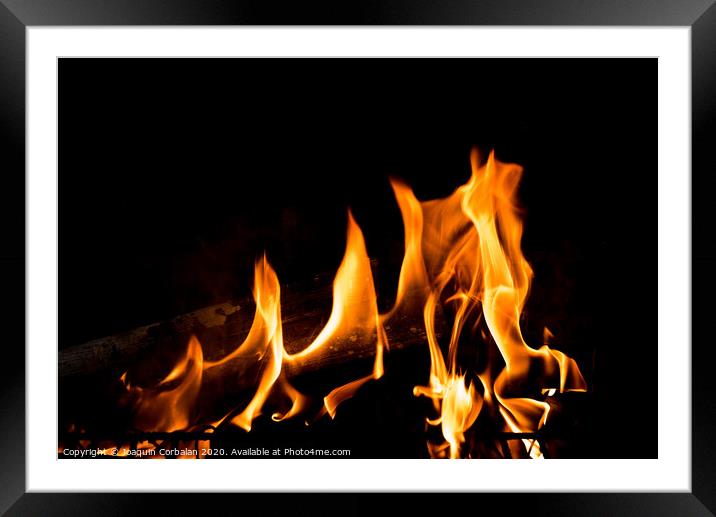 Flames in the fire of a red and yellow barbecue. Framed Mounted Print by Joaquin Corbalan