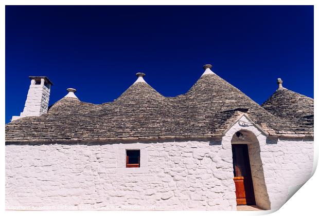Stone tiles cover the roofs of the trulli in Alberobello, an Italian city to visit on a trip to Italy. Print by Joaquin Corbalan