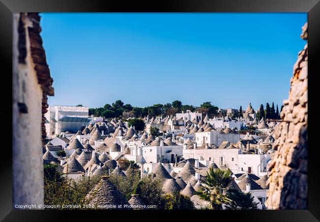 Roofs with symbols in the trulli, in the famous Italian city of Alberobello. Framed Print by Joaquin Corbalan