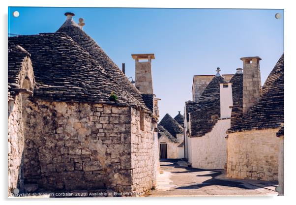 Stone tiles cover the roofs of the trulli in Alberobello, an Italian city to visit on a trip to Italy. Acrylic by Joaquin Corbalan