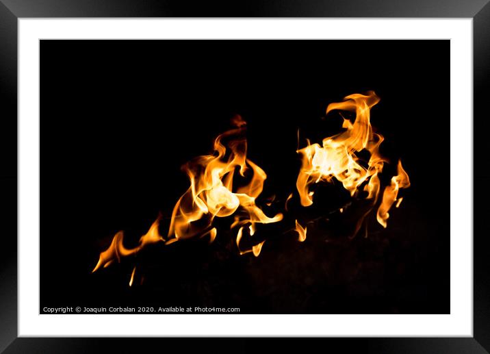 Flames in the fire of a red and yellow barbecue. Framed Mounted Print by Joaquin Corbalan