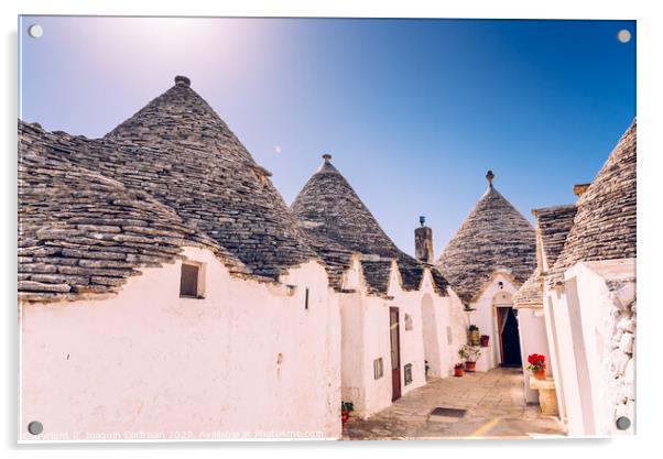 Houses of the tourist and famous Italian city of Alberobello, with its typical white walls and trulli conical roofs. Acrylic by Joaquin Corbalan