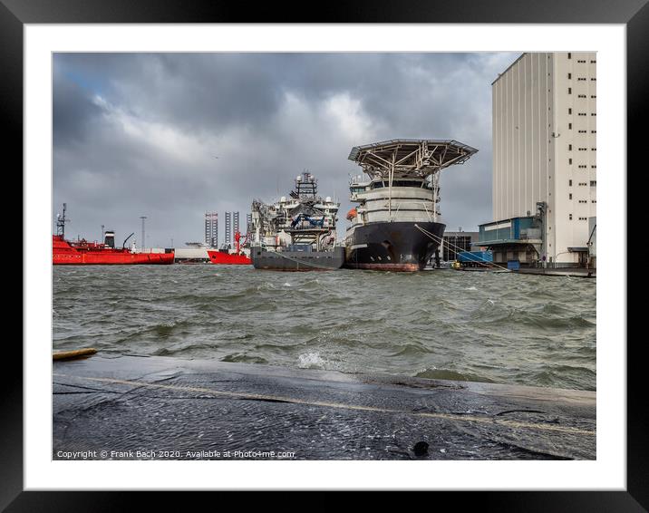 Supply ships for oil and wind power in Esbjerg flooded harbor, Denmark  Framed Mounted Print by Frank Bach