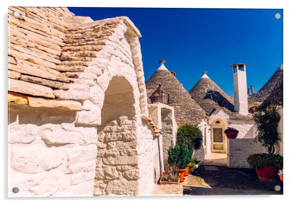 Beautiful single-storey houses of rounded construction called trulli, typical of the area of Alberobello in Italy. Acrylic by Joaquin Corbalan
