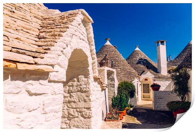 Beautiful single-storey houses of rounded construction called trulli, typical of the area of Alberobello in Italy. Print by Joaquin Corbalan