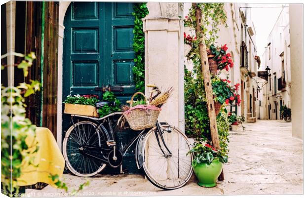 Narrow streets of the beautiful city of Bari, ideal for strolling when we tour in Italy. Canvas Print by Joaquin Corbalan