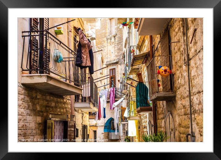 Colorful and old alleys of the touristic Italian city of Bari. Framed Mounted Print by Joaquin Corbalan