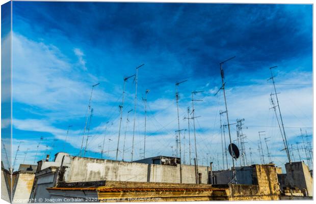 Old buildings in the city of Bari with roofs full of old television antennas. Canvas Print by Joaquin Corbalan