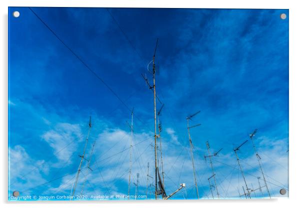 Television antennas on the roof of an old building with dramatic sky. Acrylic by Joaquin Corbalan