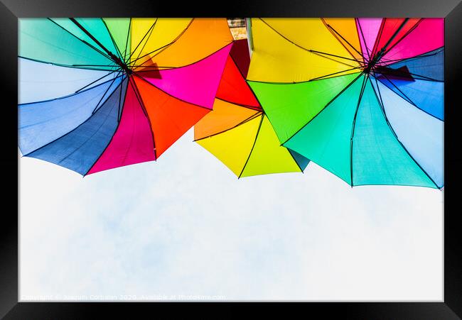 Colorful umbrellas to use as a background in bright and cheerful ideas. Framed Print by Joaquin Corbalan