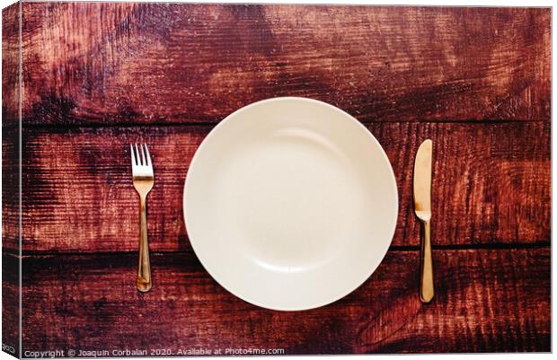 Empty plate with cutlery, top view, concept of intermittent fasting diet to lose weight. Canvas Print by Joaquin Corbalan