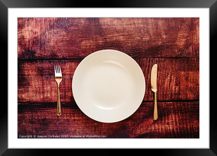 Empty plate with cutlery, top view, concept of intermittent fasting diet to lose weight. Framed Mounted Print by Joaquin Corbalan