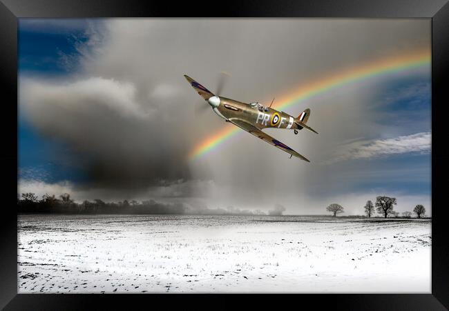 Spitfire with snow shower rainbow Framed Print by Gary Eason